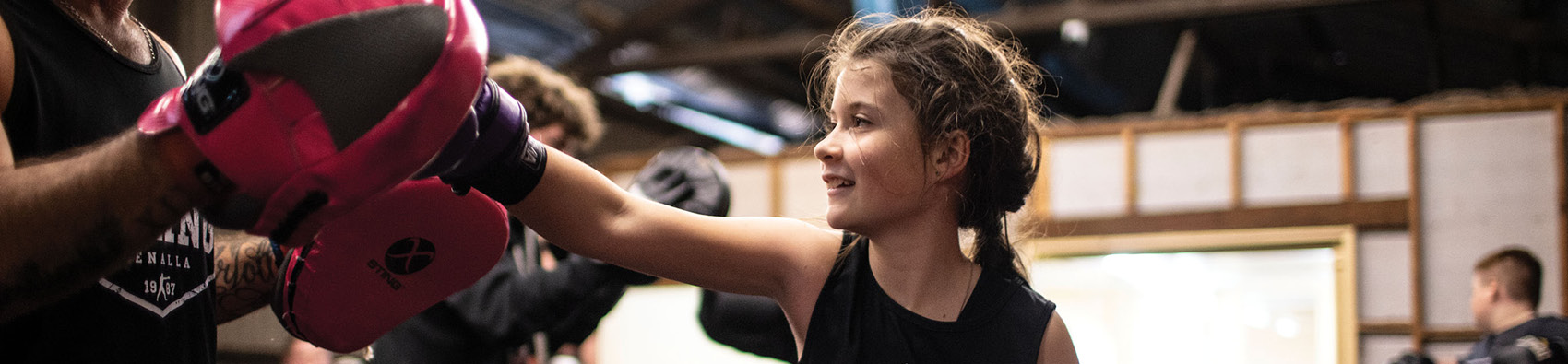 Three youths practicing boxing at Benalla Goods Shed