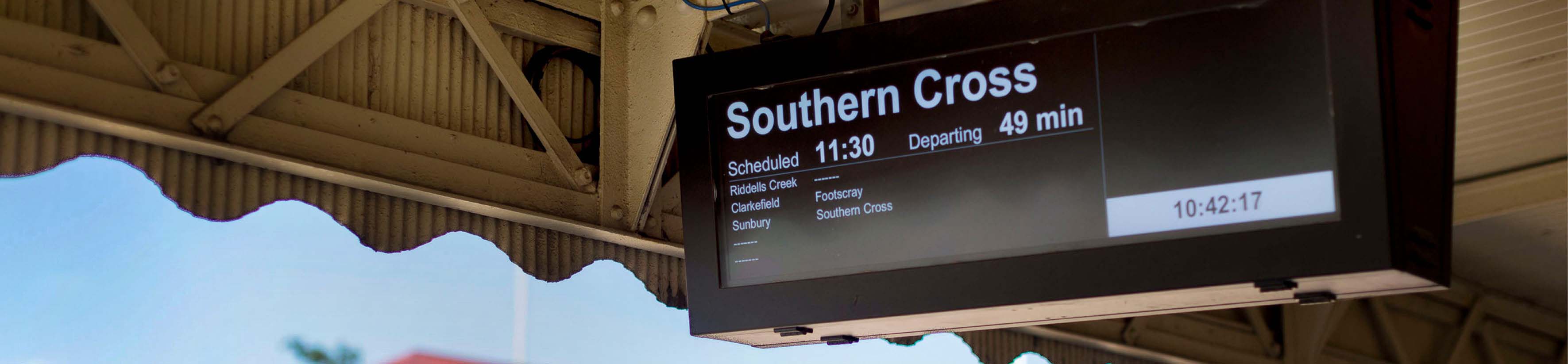 A passenger information display at a train station. It shows that the next train to Southern Cross will arrive at 11.30am.