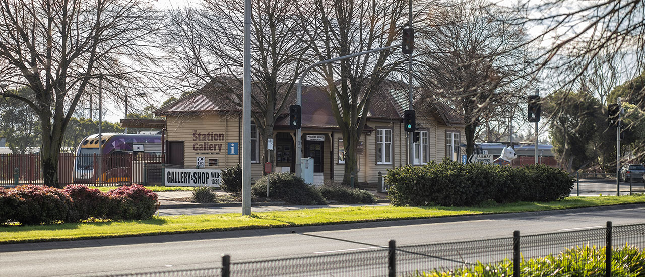 Station Gallery shop at Yarragon Station with VLine train in background.