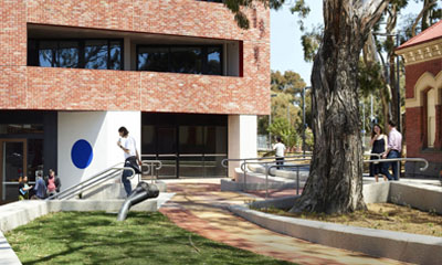 A red brick apartment development alongside Jewel Station in Brunswick.